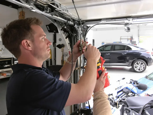 Brooklyn Garage Door Repair safety certified technician performing cable replacement in Brooklyn
