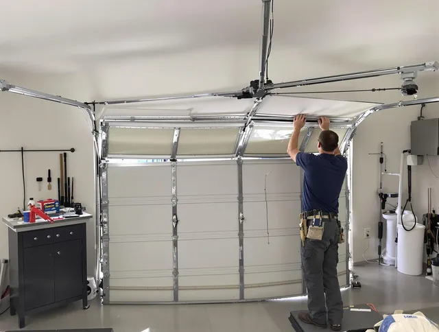 Brooklyn Garage Door Repair specialist performing precise section replacement on Brooklyn garage door